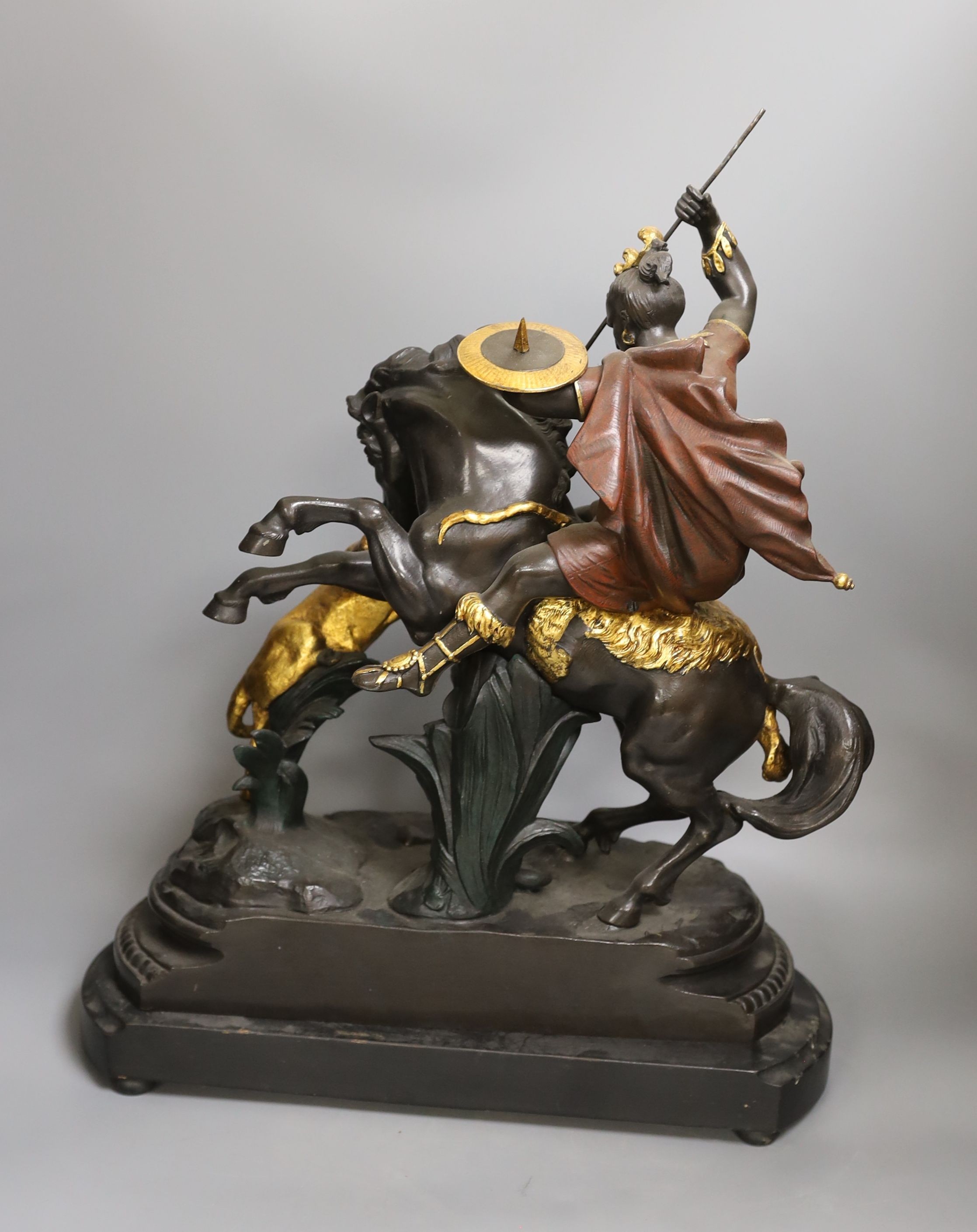 A pair of spelter warriors on horseback in action on mounted base, tallest 51cm